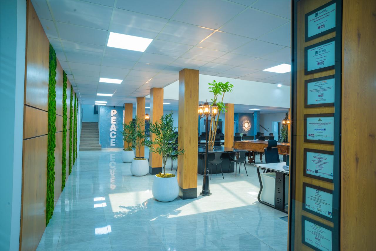 AVA Capital PEACE corridor - moss walls and reflective floors